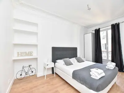 Un ou plusieurs lits dans un hébergement de l'établissement Charming 1BR 4P apartment - Louvre Museum