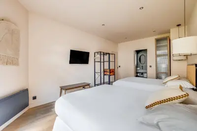 Un ou plusieurs lits dans un hébergement de l'établissement Spacious Apartment - 2BR 10P - Place d'Italie