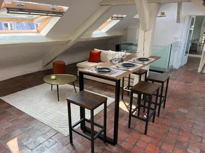 Coin salon dans l'établissement Penbed - Place Vendome - 1BR
