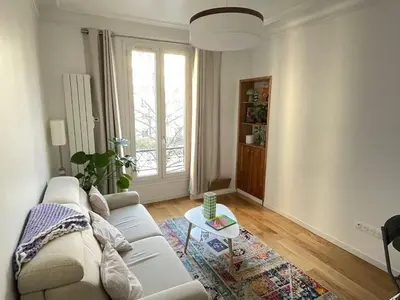 Coin salon dans l'établissement 11th Arrondissement Homey Warm Apartment