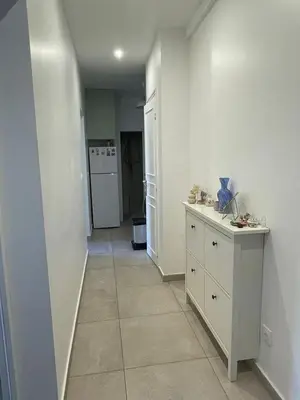 Cuisine ou kitchenette dans l'établissement 11th Arrondissement Homey Warm Apartment