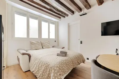 Un ou plusieurs lits dans un hébergement de l'établissement Marais-Montorgueil - Cozy Apartment - 2BR-8P