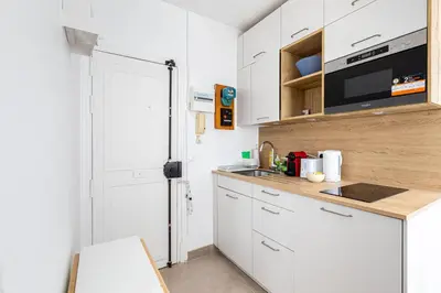 Cuisine ou kitchenette dans l'établissement GuestReady - Charming Marais midterm stay