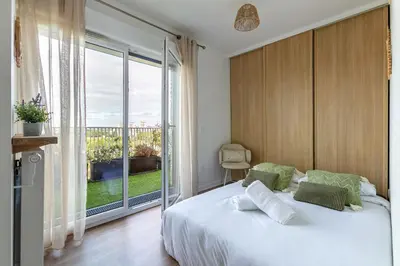 Un ou plusieurs lits dans un hébergement de l'établissement Seine et Parc by So Homy - 3 Bed Room - 6 People