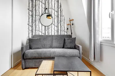 Coin salon dans l'établissement BM- Petit Nid Cosy a Montparnasse - Studio equipe