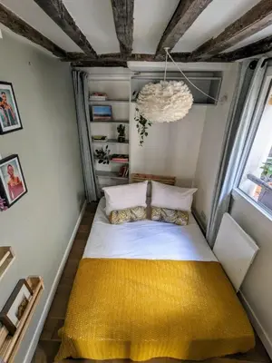 Un ou plusieurs lits dans un hébergement de l'établissement Elegant apartment in Montorgueil