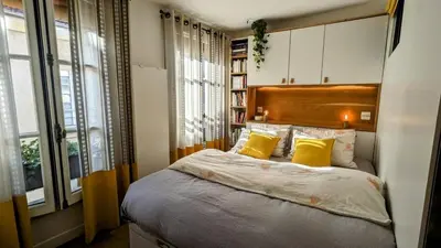 Un ou plusieurs lits dans un hébergement de l'établissement Elegant apartment in Montorgueil