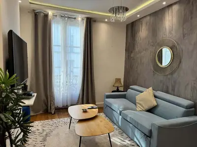 Coin salon dans l'établissement Celine 27 Le reflet du Rocher, Appart à deux pas de l'Arc