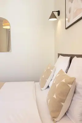 Un ou plusieurs lits dans un hébergement de l'établissement Cosy et climatisé - Aux portes de Paris