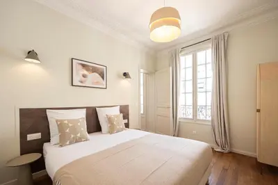 Un ou plusieurs lits dans un hébergement de l'établissement Cosy et climatisé - Aux portes de Paris