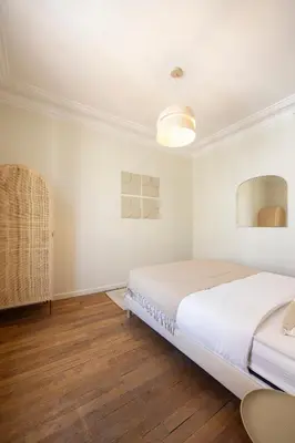 Un ou plusieurs lits dans un hébergement de l'établissement Cosy et climatisé - Aux portes de Paris