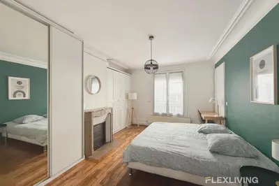 Un ou plusieurs lits dans un hébergement de l'établissement Charming 2-Bedroom Apartment in Paris 5
