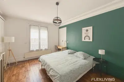 Un ou plusieurs lits dans un hébergement de l'établissement Charming 2-Bedroom Apartment in Paris 5