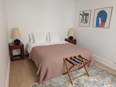 Un ou plusieurs lits dans un hébergement de l'établissement Appartement Paris Champs-Elysées