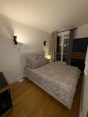 Un ou plusieurs lits dans un hébergement de l'établissement Appartement Montparnasse chic&moderne