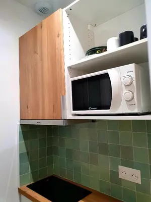 Cuisine ou kitchenette dans l'établissement Studio moderne proche de Paris