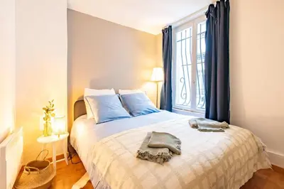 Un ou plusieurs lits dans un hébergement de l'établissement 4 Guests Flat - Place Monge