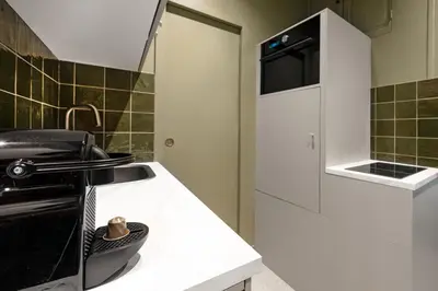 Cuisine ou kitchenette dans l'établissement Loft design with sauna and home cinema