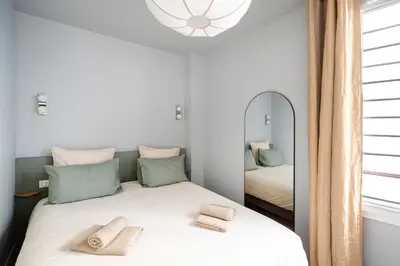 Un ou plusieurs lits dans un hébergement de l'établissement Loft design and cosy, Montparnasse