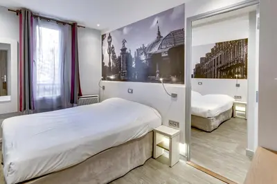 Un ou plusieurs lits dans un hébergement de l'établissement Kyriad Paris 12 - Nation