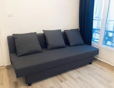 Coin salon dans l'établissement Appartement moderne & cosy au cœur de Paris