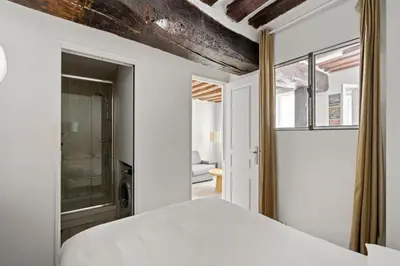 Un ou plusieurs lits dans un hébergement de l'établissement Appartement Typiquement Parisien