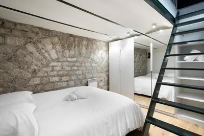Un ou plusieurs lits dans un hébergement de l'établissement Studio in Montmartre