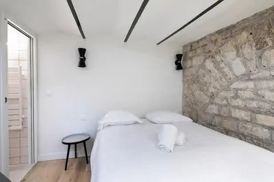 Un ou plusieurs lits dans un hébergement de l'établissement Studio in Montmartre