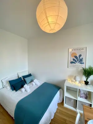 Un ou plusieurs lits dans un hébergement de l'établissement New 341 Suite Alfred - Cosy Apartment Paris Center