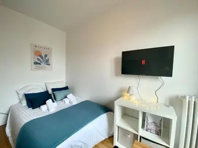Un ou plusieurs lits dans un hébergement de l'établissement New 341 Suite Alfred - Cosy Apartment Paris Center