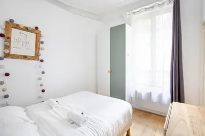Un ou plusieurs lits dans un hébergement de l'établissement GuestReady - Charm & comfort in Charonne District
