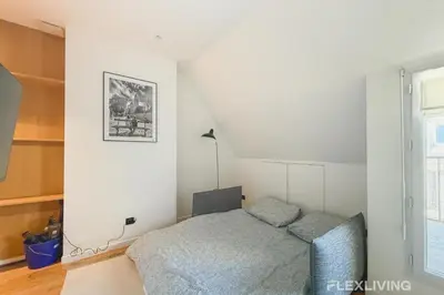 Un ou plusieurs lits dans un hébergement de l'établissement Charming Studio in the Heart of Paris 8th
