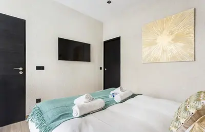 Un ou plusieurs lits dans un hébergement de l'établissement Appartement de Charme 2BR Alexandre Dumas
