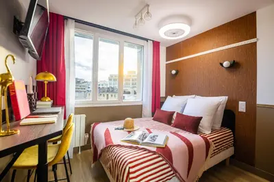 Un ou plusieurs lits dans un hébergement de l'établissement ARK Hôtel Paris Boulogne