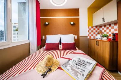 Un ou plusieurs lits dans un hébergement de l'établissement ARK Hôtel Paris Boulogne