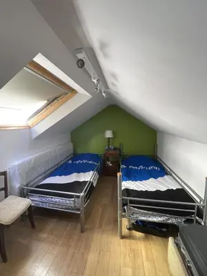 Un ou plusieurs lits dans un hébergement de l'établissement Maison de ville jardin derrière cité U à Gentilly