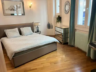 Un ou plusieurs lits dans un hébergement de l'établissement Appartement Tour Eiffel Marois