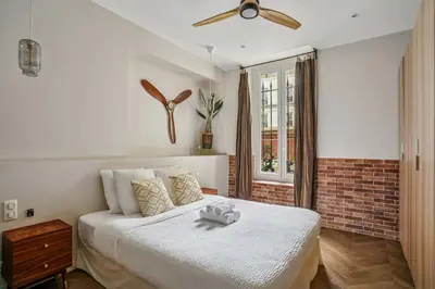 Un ou plusieurs lits dans un hébergement de l'établissement Luxury family Duplex 4 bdrs 10P - Republique