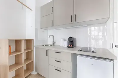 Cuisine ou kitchenette dans l'établissement Mykeypers- Luxury Studio 2P - Malakoff 14
