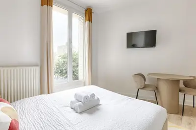 Un ou plusieurs lits dans un hébergement de l'établissement Mykeypers- Luxury Studio 2P - Malakoff 14