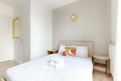 Un ou plusieurs lits dans un hébergement de l'établissement Mykeypers- Luxury Studio 2P - Malakoff 14