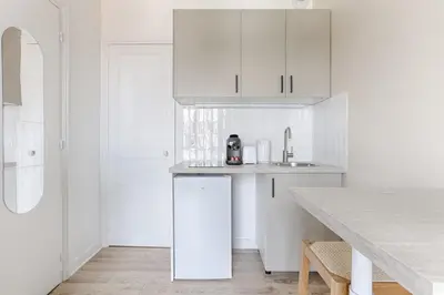 Cuisine ou kitchenette dans l'établissement Mykeypers- Premium Studio 2P - Malakoff 35