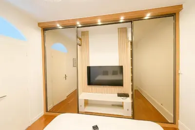Télévision ou salle de divertissement dans l'établissement Appartement familial centre nation - 6 personnes