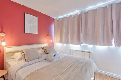 Un ou plusieurs lits dans un hébergement de l'établissement Saint-Augustin - Appartement Opéra 6P
