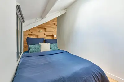 Un ou plusieurs lits dans un hébergement de l'établissement Duplex central Métro 1 5 8Direct Le Louvre