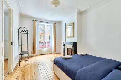 Un ou plusieurs lits dans un hébergement de l'établissement Appartement Idéal près des Quais de Seine-métro 7-6-5