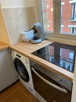 Cuisine ou kitchenette dans l'établissement Moulin à vent 13