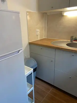 Cuisine ou kitchenette dans l'établissement Moulin à vent 13