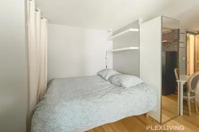 Un ou plusieurs lits dans un hébergement de l'établissement Charming 22m Studio in Paris 11
