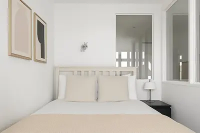 Un ou plusieurs lits dans un hébergement de l'établissement Sublime suite Avenue des Champs-Élysées